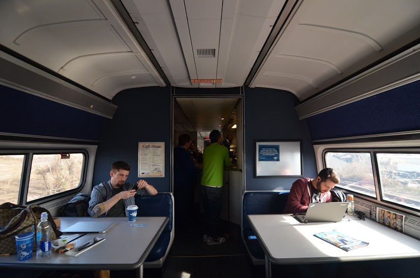 Amtrak working in car