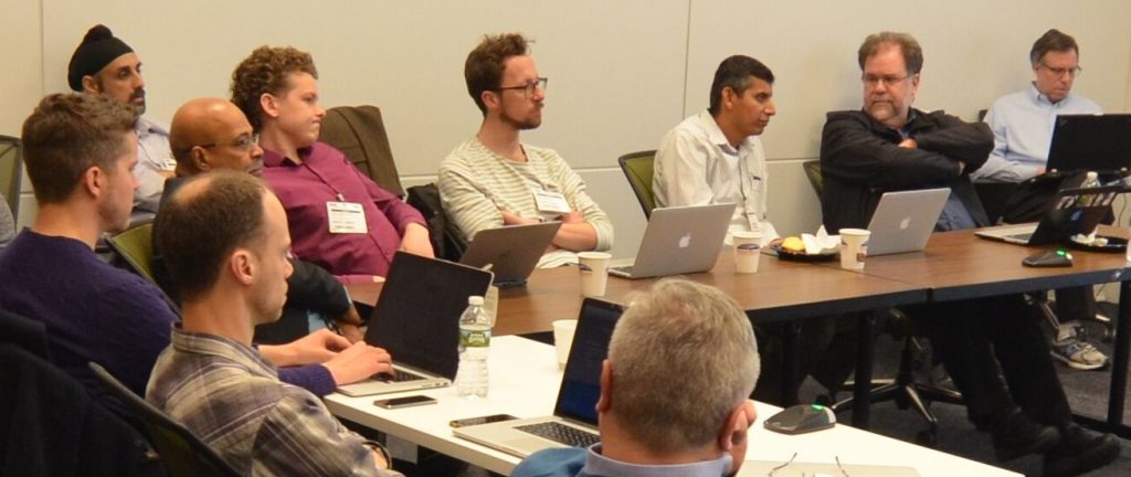 Hyperledger Identity workgroup lead Christopher Allen (right) listens amidst intense discussion